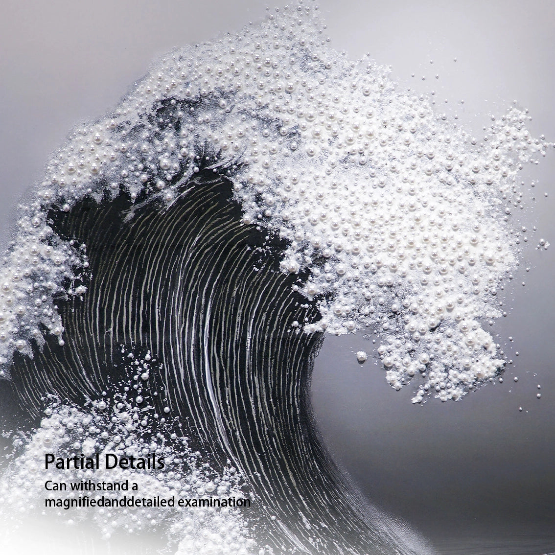 Close up of textured black wave wall art with pearl inlay detail.