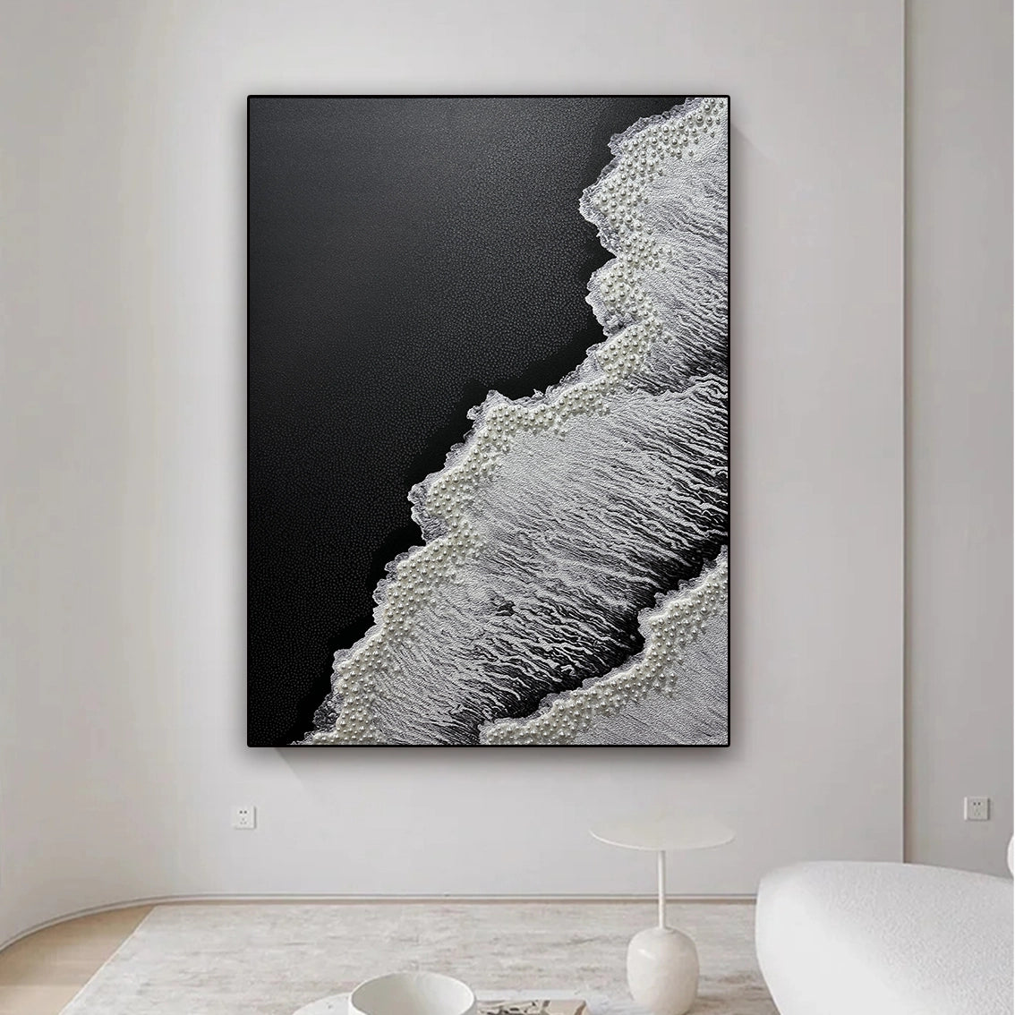 Black white abstract wall art featuring heavy texture and pearl inlay, styled in a clean contemporary interior.