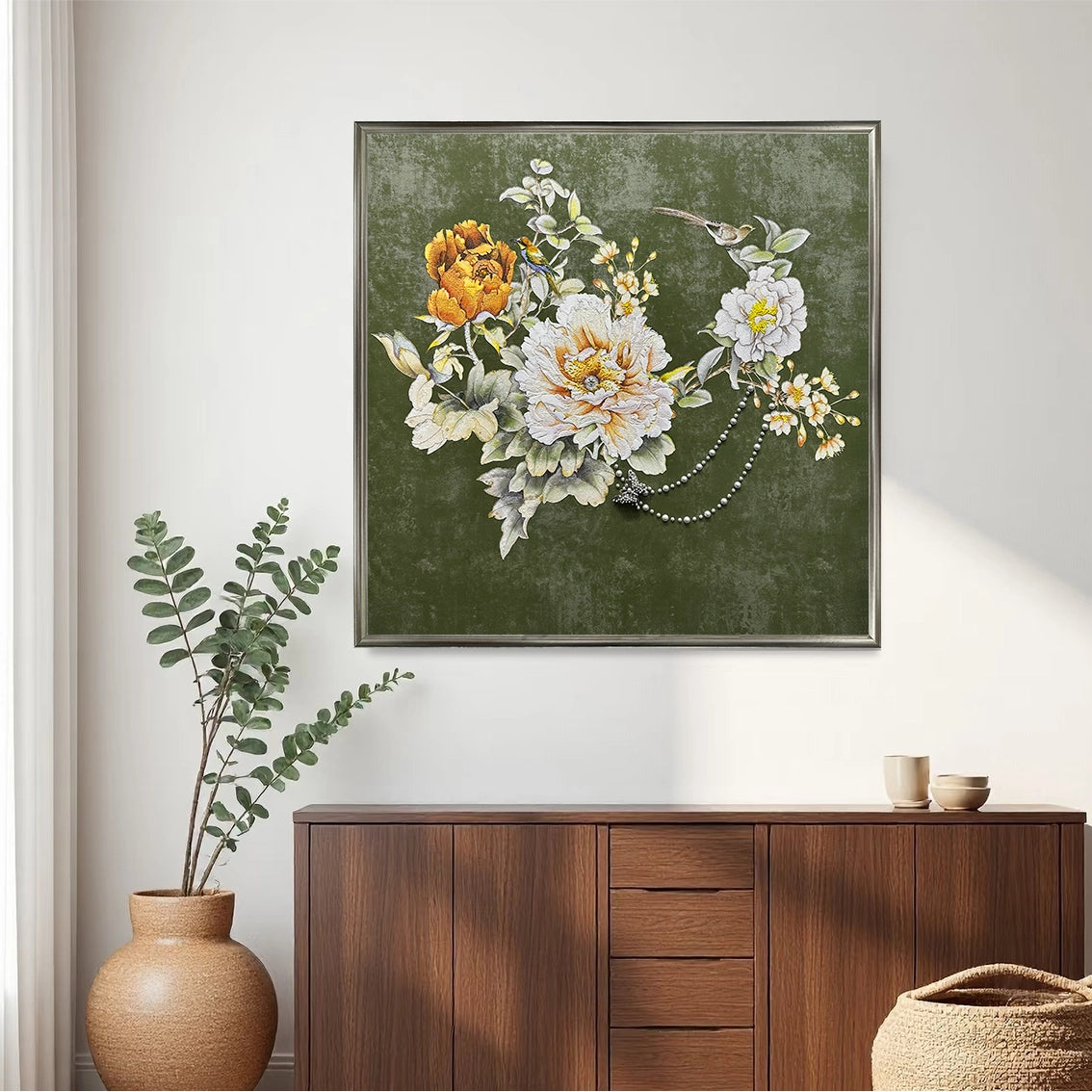Floral pearl inlay textured wall art on green background styled above a wooden sideboard.