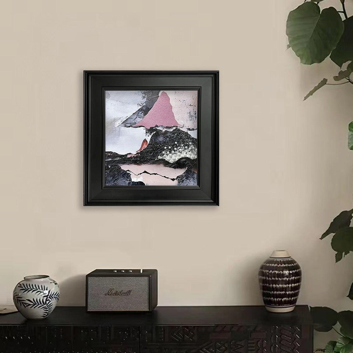 Textured abstract mountain wall art with pearl inlay, adding modern elegance to a neutral living space.