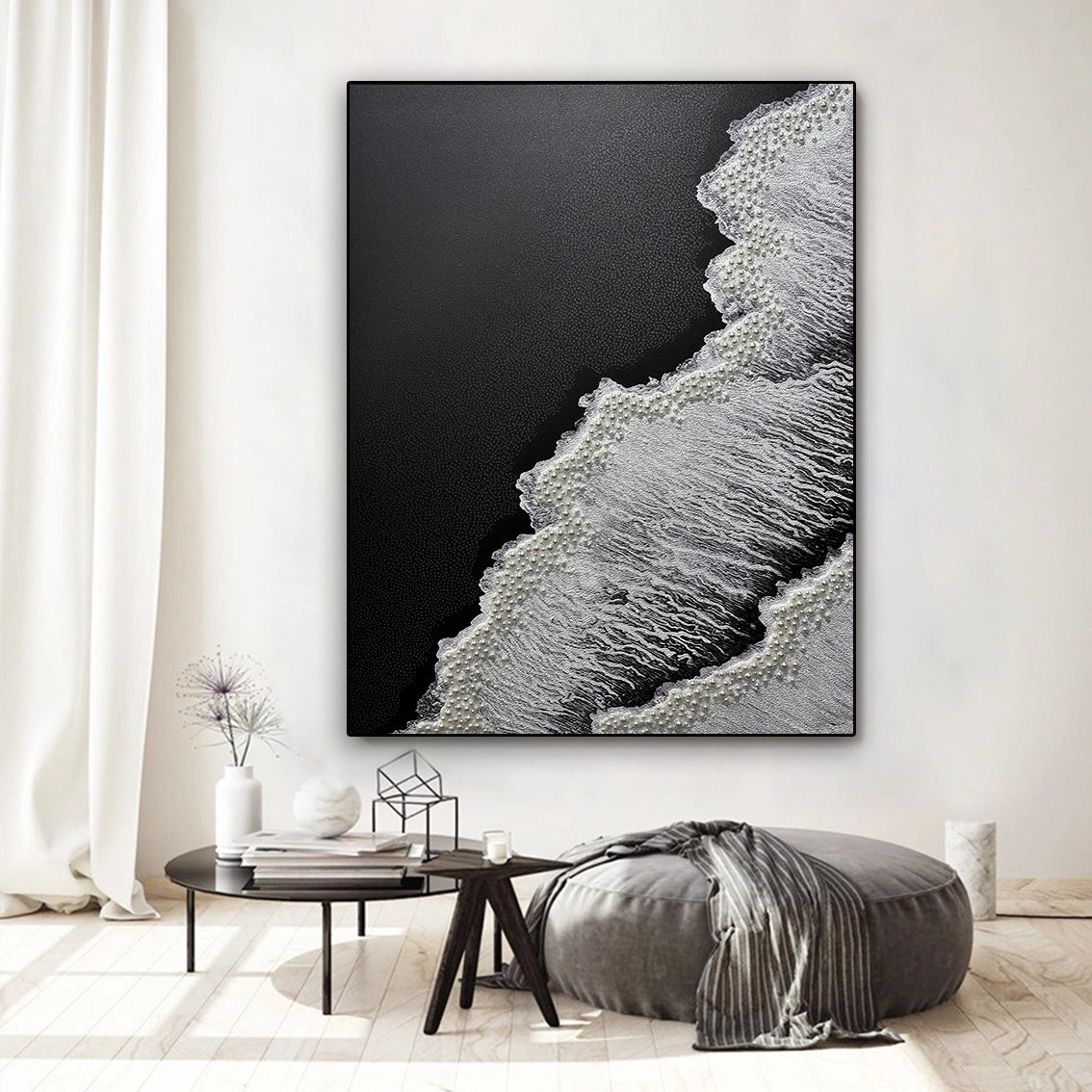 Abstract black white textured wall art featuring pearl inlay, enhancing luxury decor in a bright modern room.