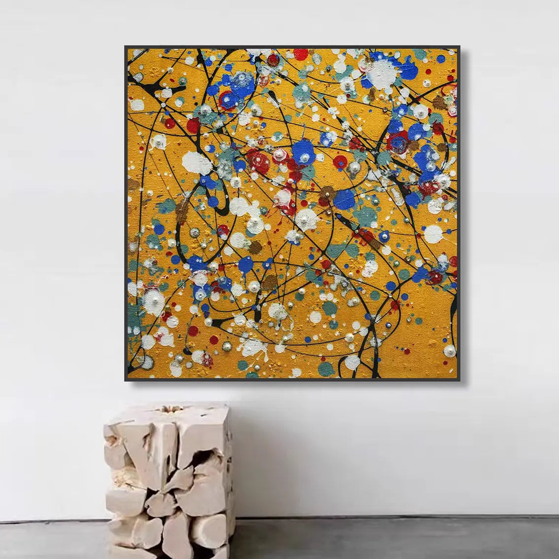 Abstract textured pearl wall art displayed in a modern interior with vibrant yellow tones.