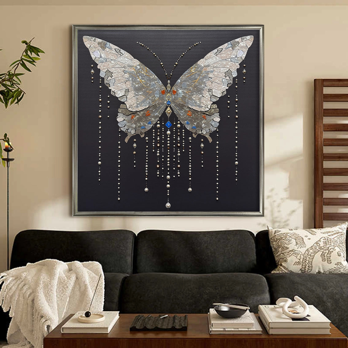 Textured butterfly wall decor with pearl inlay hanging above a cozy living space setting.