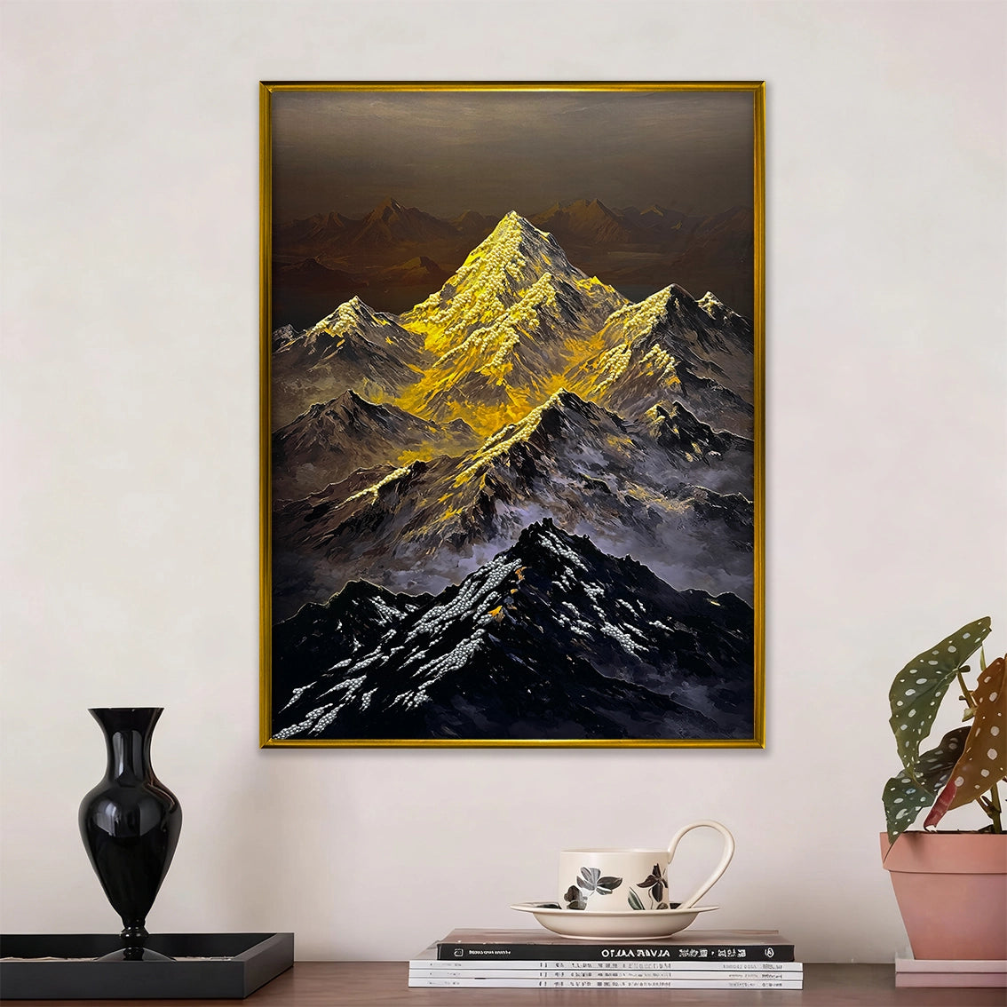 Textured mountain wall art with pearl inlay displayed above a modern tabletop in a cozy interior.